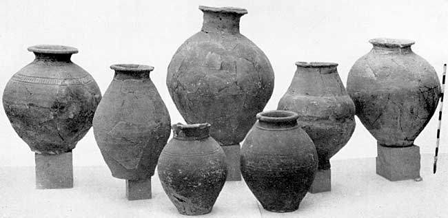 PLATE XIX. Pottery of third century well.