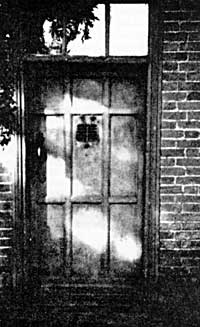 Door with grille of old hall of Hacker family (built 1625).