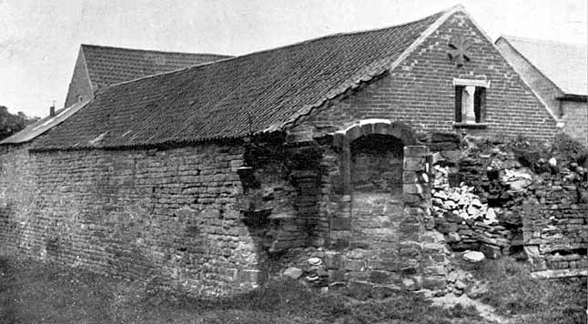 Outbuildings of Greasley Castle Farm containing ancient stonework.