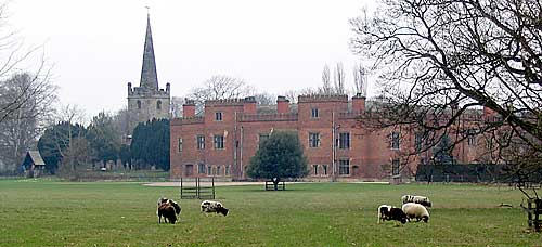 Holme Pierrepont Hall and church in 2004. The brick south entrance range seen here dates from the early 16th century.