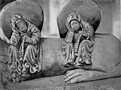 At the foot of John de Strelley's effigy.