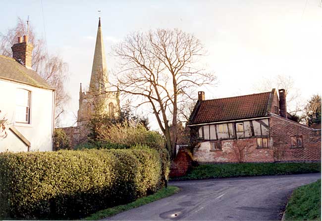 Scrooby church and Brewster's Cottage (photo: A Nicholson, 1998).