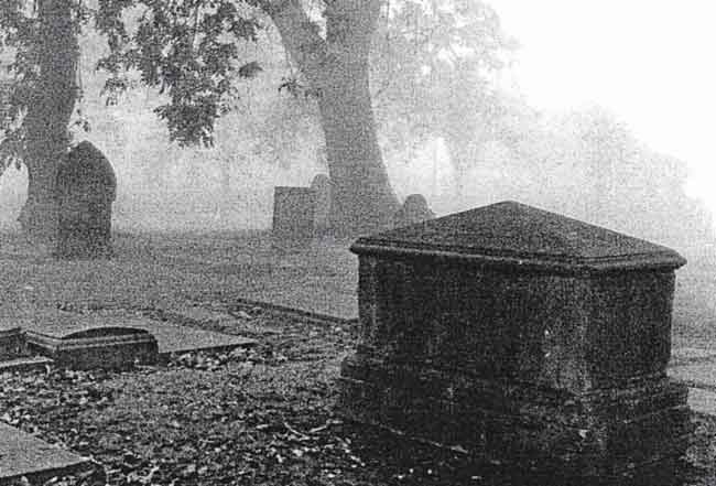 Autumn mist in the churchyard 1992. The large memorial is that of the Rev. Edward Williams.