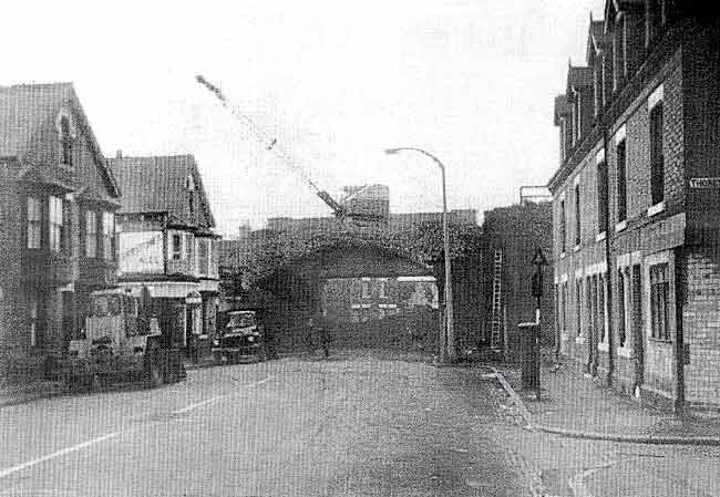 Demolition of the Meadow Lane masonry bridge on the Manvers Street branch, c. 1968. The off-licence on the left is at the corner of Lindum Grove. (Photo: Anne Day collection).